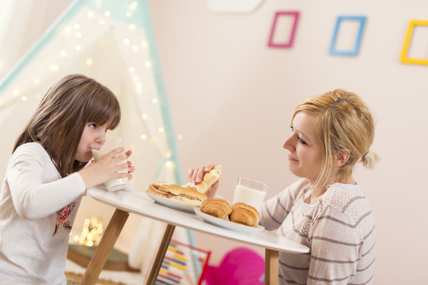 An image of a mother and daughter having breakfast together to start the day.
